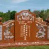 Large, orange, ethnic, Asian granite memorial gravestone