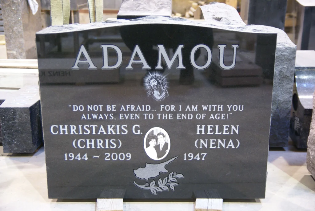 Black granite memorial with engraved pictures