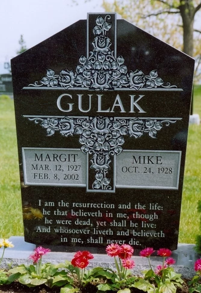 Black granite gravestone with roses