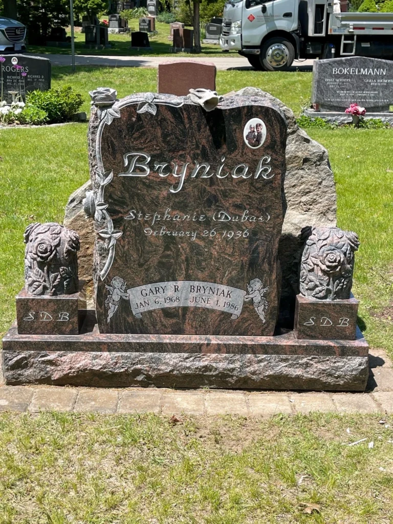 Custom red granite memorial with roses