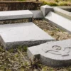 A broken granite cemetery memorial or monument