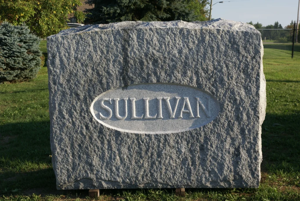 A large, grey granite memorial